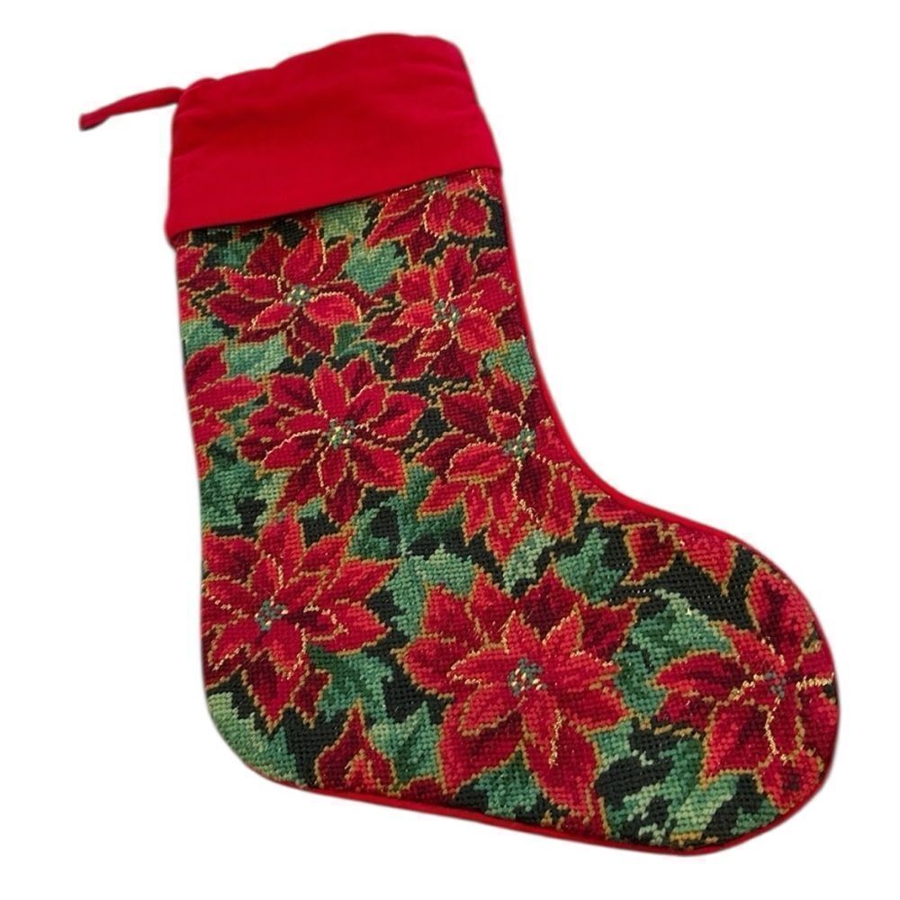 Needlepoint Christmas stocking poinsettias. They’ve been on one side.